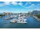 Aerial view of a marina, featuring numerous boats and the surrounding cityscape at 35 Watergate Dr # 1203, Sarasota, FL 34236