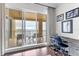 Office features sliding doors to a balcony with water views at 35 Watergate Dr # 1203, Sarasota, FL 34236