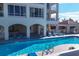 Resort-style pool with plenty of lounge chairs at 35 Watergate Dr # 1203, Sarasota, FL 34236