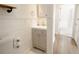 Small bathroom with vanity, toilet and wood-look flooring at 3629 Taro Pl, Sarasota, FL 34232