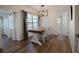 Farmhouse-style dining area with wooden table and chairs at 3629 Taro Pl, Sarasota, FL 34232