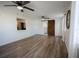 Open living area with hardwood floors and a view into the kitchen at 3629 Taro Pl, Sarasota, FL 34232