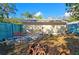 Large backyard with patio, fire pit, and detached structure at 3826 Rilma Ave, Sarasota, FL 34234