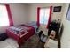 Small bedroom with a twin bed and workspace at 3826 Rilma Ave, Sarasota, FL 34234
