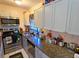 Small kitchen with stainless steel appliances and granite countertops at 3826 Rilma Ave, Sarasota, FL 34234