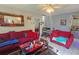 Cozy living room with red couches and a Christmas tree at 3826 Rilma Ave, Sarasota, FL 34234