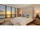 Elegant bedroom with large windows offering stunning ocean views at 435 L Ambiance Dr # K405, Longboat Key, FL 34228