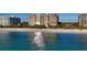 Oceanfront building, white sand beach, blue water at 435 L Ambiance Dr # M408, Longboat Key, FL 34228