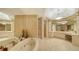 Spa-like bathroom with soaking tub and double vanity at 435 L Ambiance Dr # M408, Longboat Key, FL 34228