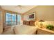 Bright bedroom with balcony access and comfortable furnishings at 435 L Ambiance Dr # M408, Longboat Key, FL 34228