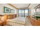 Ocean view bedroom with queen-size bed and balcony access at 435 L Ambiance Dr # M408, Longboat Key, FL 34228