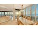 Elegant dining room with ocean views and a large marble table at 435 L Ambiance Dr # M408, Longboat Key, FL 34228