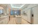 Well-equipped kitchen featuring white cabinets and a large island at 435 L Ambiance Dr # M408, Longboat Key, FL 34228
