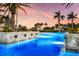 Expansive pool with cascading waterfalls and elegant tile work at 435 L Ambiance Dr # M408, Longboat Key, FL 34228