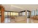 Living room with panoramic ocean view and sunset at 435 L Ambiance Dr # M408, Longboat Key, FL 34228
