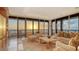 Living room with large windows, ocean view, sunset at 435 L Ambiance Dr # M408, Longboat Key, FL 34228