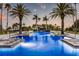 Inviting swimming pool with palm trees and a relaxing atmosphere at 435 L Ambiance Dr # M408, Longboat Key, FL 34228