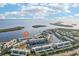 Aerial view of waterfront condo community with lush landscaping and private boat docks at 4430 Exeter Dr # M108, Longboat Key, FL 34228
