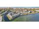 Aerial view of a waterfront condo community with multiple buildings and a pool at 4430 Exeter Dr # M108, Longboat Key, FL 34228