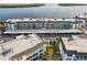 Aerial view of building and parking at 4430 Exeter Dr # M108, Longboat Key, FL 34228