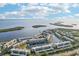 Aerial view of waterfront community with lush landscaping and private boat docks at 4430 Exeter Dr # M108, Longboat Key, FL 34228