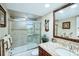 Updated bathroom with granite vanity and walk-in shower at 4430 Exeter Dr # M108, Longboat Key, FL 34228