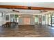 Spacious community room with hardwood floors and large windows at 4430 Exeter Dr # M108, Longboat Key, FL 34228