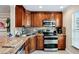 Modern kitchen with stainless steel appliances and granite countertops at 4430 Exeter Dr # M108, Longboat Key, FL 34228