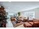 Bright and airy living room features floor-to-ceiling windows with views of the water at 4430 Exeter Dr # M108, Longboat Key, FL 34228