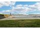 Community pool with patio furniture and waterfront access at 4430 Exeter Dr # M108, Longboat Key, FL 34228