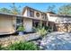 Two-story house with stone accents and a water feature at 4938 Hubner Cir, Sarasota, FL 34241