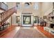 Spacious living room with hardwood floors, high ceilings, and a stone fireplace at 4938 Hubner Cir, Sarasota, FL 34241