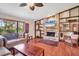 Spacious living room showcasing a stone fireplace and hardwood floors at 4938 Hubner Cir, Sarasota, FL 34241
