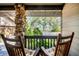 Relaxing porch with rocking chairs overlooking a scenic waterfront view at 4938 Hubner Cir, Sarasota, FL 34241