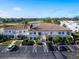 Aerial view of condo community with parking and golf course at 5208 Wedgewood Ln # 75, Sarasota, FL 34235