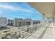 Spacious balcony with city views and glass railings at 540 N Tamiami Trl # 1204, Sarasota, FL 34236