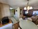 Dining area with round table and chairs, open to kitchen and living room at 5414 Burma Ct, Bradenton, FL 34207