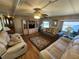 Living room with two sofas, wood flooring, and an entertainment center at 5414 Burma Ct, Bradenton, FL 34207
