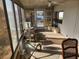 Bright sunroom with ample windows, ceiling fan, and comfortable seating at 5414 Burma Ct, Bradenton, FL 34207