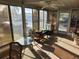 Bright sunroom with ample windows, ceiling fan, and comfortable seating at 5414 Burma Ct, Bradenton, FL 34207