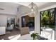 Dining area with a unique light fixture and views of the backyard at 5505 Pheasant Ln, Bradenton, FL 34209