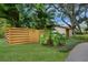 Wooden gate and lush landscaping along the side yard at 5505 Pheasant Ln, Bradenton, FL 34209