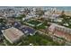 Aerial view of a residential community with buildings, parking, and surrounding cityscape at 628 Cohen Way # 628, Sarasota, FL 34236