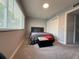 Bedroom with carpet flooring, bed, and closet with sliding doors at 628 Cohen Way # 628, Sarasota, FL 34236
