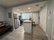 Modern kitchen with white cabinets, butcher block countertops, stainless steel appliances, and wood-look flooring at 628 Cohen Way # 628, Sarasota, FL 34236