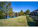 Spacious backyard with lush landscaping and lake view at 7223 Orchid Island Pl, Bradenton, FL 34202