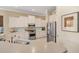 Bright kitchen with stainless steel appliances, white cabinetry, and light countertops at 7223 Orchid Island Pl, Bradenton, FL 34202