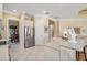 Bright kitchen with stainless steel refrigerator and tile floor at 7223 Orchid Island Pl, Bradenton, FL 34202