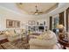 Bright living room featuring hardwood floors, a coffered ceiling, and ample seating at 7223 Orchid Island Pl, Bradenton, FL 34202