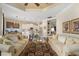Open concept living area with kitchen views, hardwood floors, and comfortable seating at 7223 Orchid Island Pl, Bradenton, FL 34202